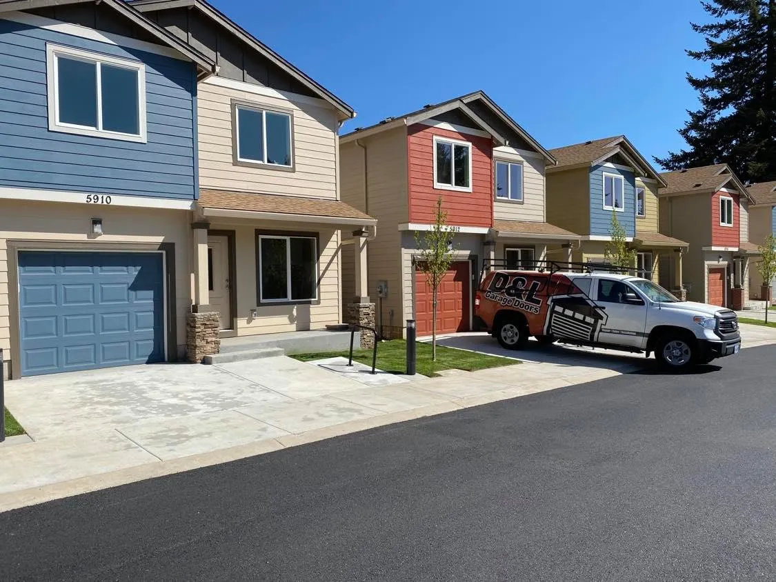 D&L Garage Doors service truck at a residential property
